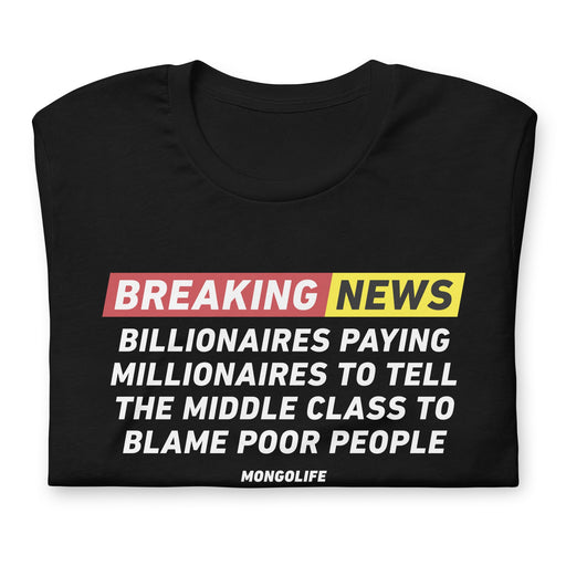 Folded "Breaking News" t-shirt with impactful text discussing the narrative of billionaires, millionaires, and societal blame.