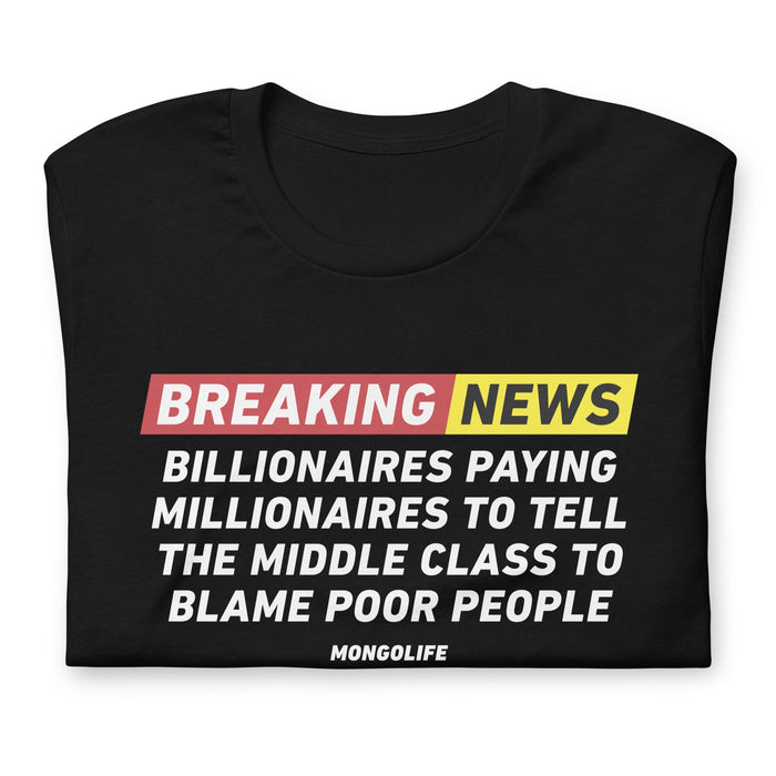 Folded "Breaking News" t-shirt with impactful text discussing the narrative of billionaires, millionaires, and societal blame.