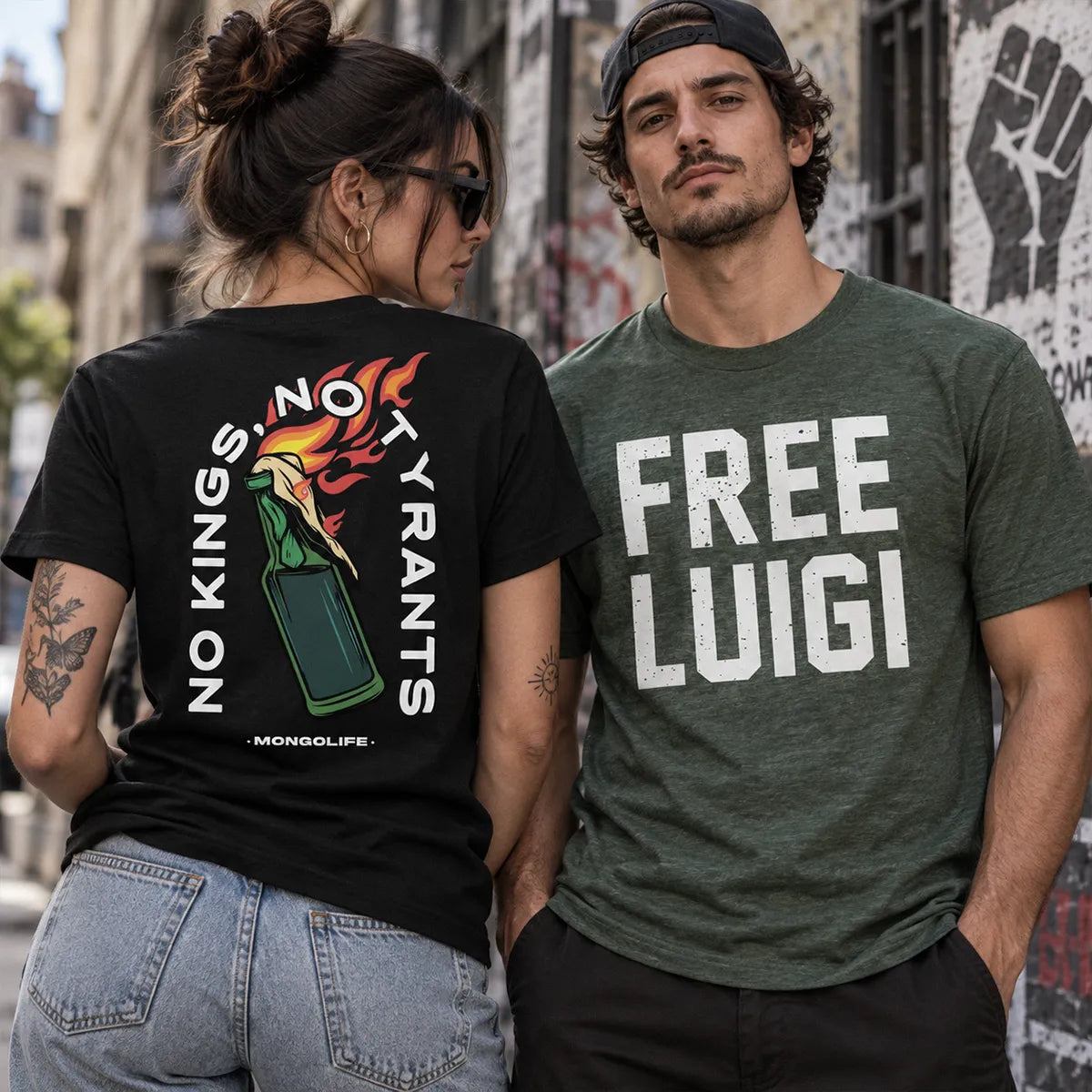 Woman wearing a black No Kings No Tyrants T-shirt beside a man wearing a green Free Luigi T-shirt in an urban streetwear setting.