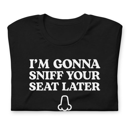 Black folded “I’m Gonna Sniff Your Seat” T-shirt with a small nose icon, part of the embarrassing T-shirts collection.