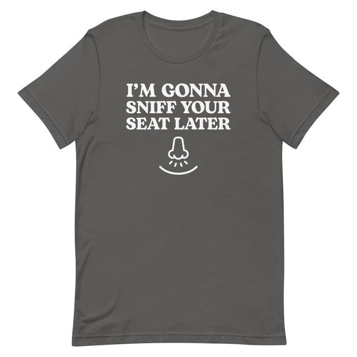 Asphalt gray “I’m Gonna Sniff Your Seat” T-shirt with a small nose icon, part of the embarrassing T-shirts collection.