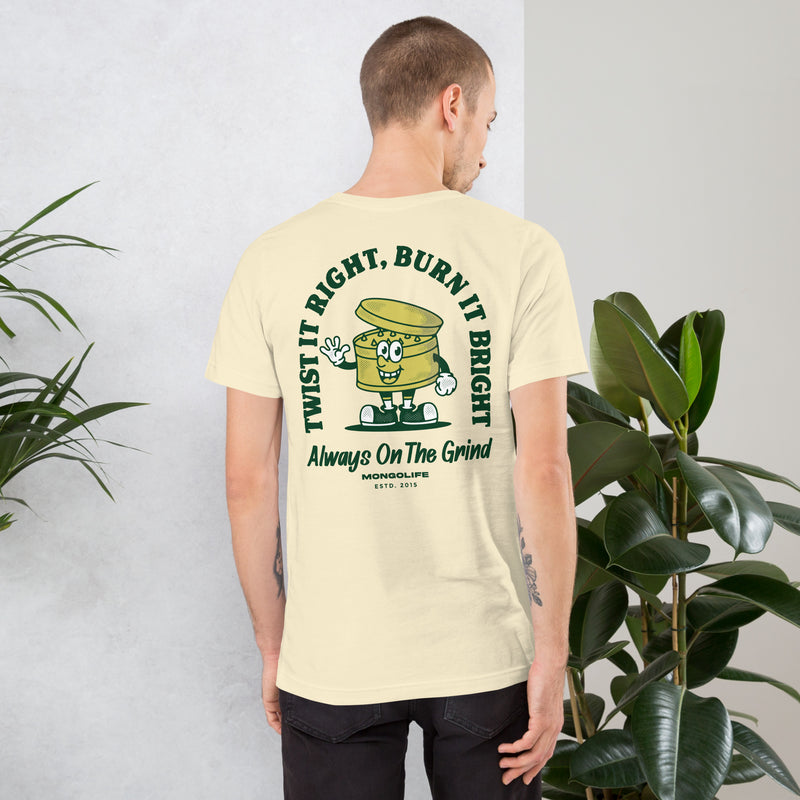 Male model wearing a beige Always on the Grind T-shirt, showing the back design with a weed grinder cartoon.