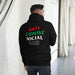 Model wearing black Anti Zionist Social Club hoodie showing back design.