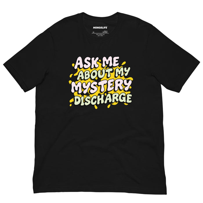 Black t-shirt with bold text “Ask Me About My Mystery Discharge” in cartoonish pastel letters with gooey drips.