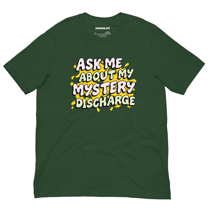 Forest green shirt with “Ask Me About My Mystery Discharge” graphic in bright, off‑white drippy letters.