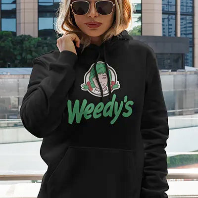 woman wearing a black hoodie with the Weedy's logo