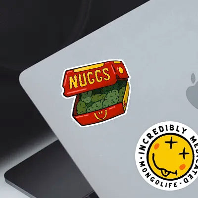 "McNuggs weed sticker" and "Incredibly Medicated - Sticker" on a Macbook laptop