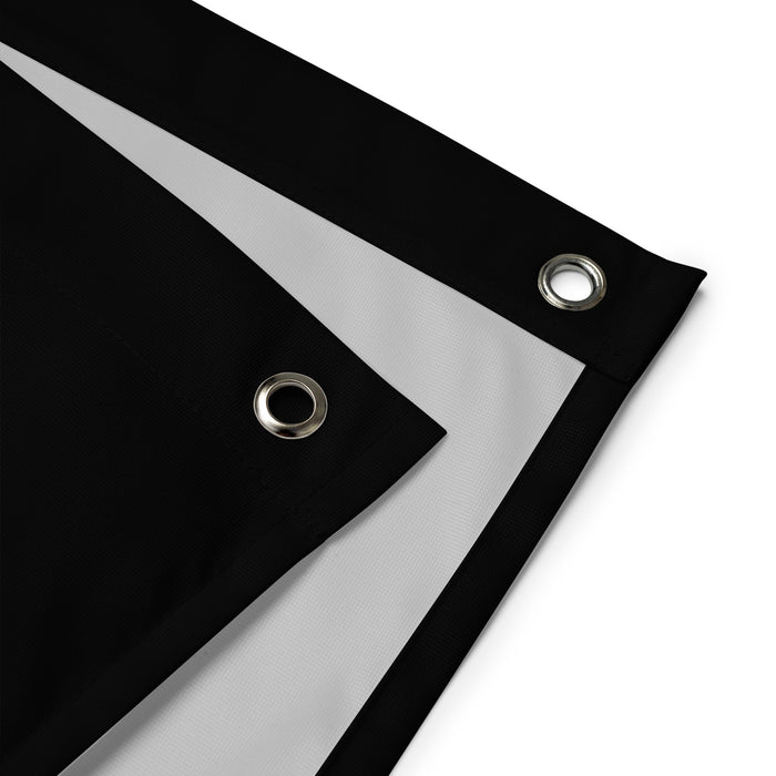 Close-up view of the Deny Defend Depose flag's durable polyester fabric and iron grommets for easy installation.