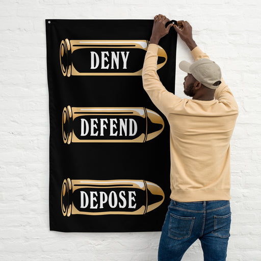 Person hanging the Deny Defend Depose flag, showcasing its bold graphic design and sturdy iron grommets.