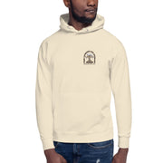 Male model wearing the Espresso Martini hoodie in beige, showing the front design with a small martini glass cartoon on the left chest.