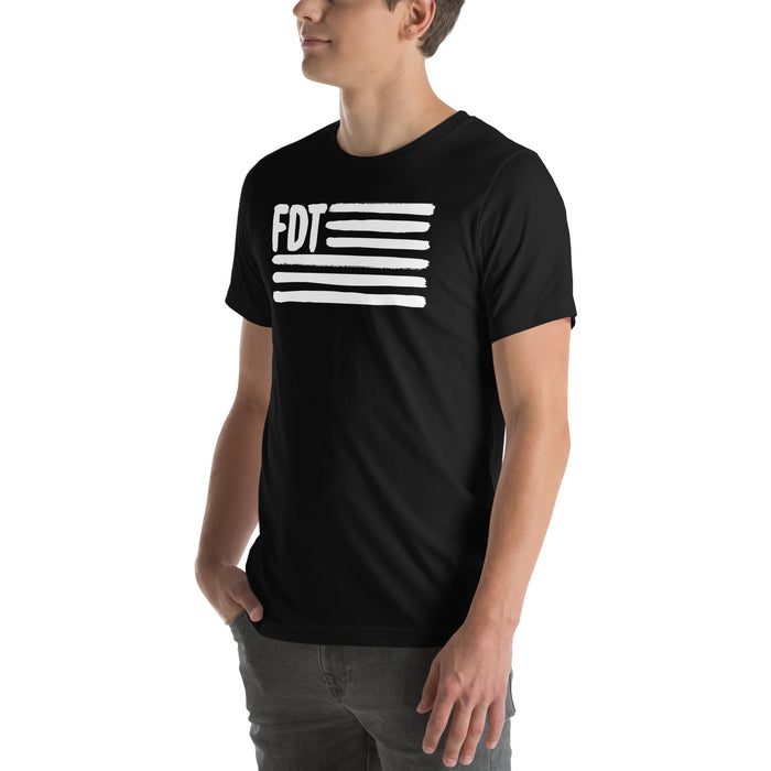 Person wearing black FDT protest tee with urban flag print design