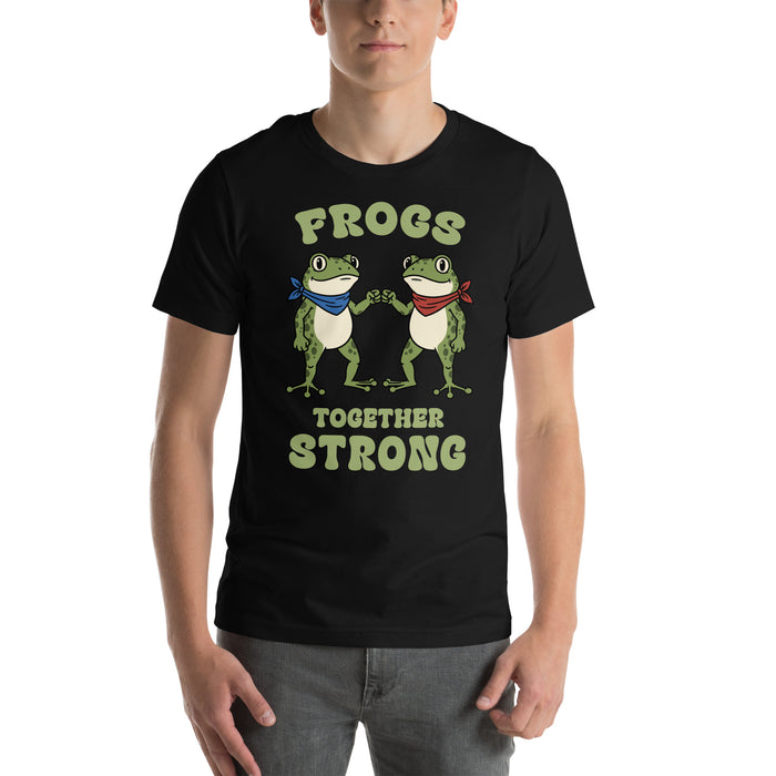 Model wearing black “Frogs Together Strong” t-shirt showing front graphic with two frogs and playful activist-style design inspired by Portland, OR.