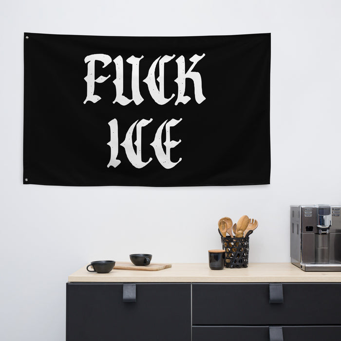 “Fuck ICE” flag displayed on a wall above a modern kitchen shelf