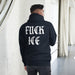 man wearing black fuck ice hoodie anti ice political streetwear outfit for protest and activism