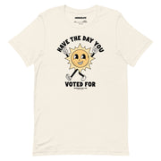 Vintage white t-shirt featuring a smiling sun cartoon and the phrase "Have The Day You Voted For" in bold, curved lettering.