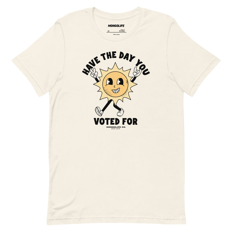 Vintage white t-shirt featuring a smiling sun cartoon and the phrase "Have The Day You Voted For" in bold, curved lettering.