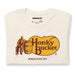 Close-up of folded Vintage White shirt showing "Honky Bucket" logo parody in detail.