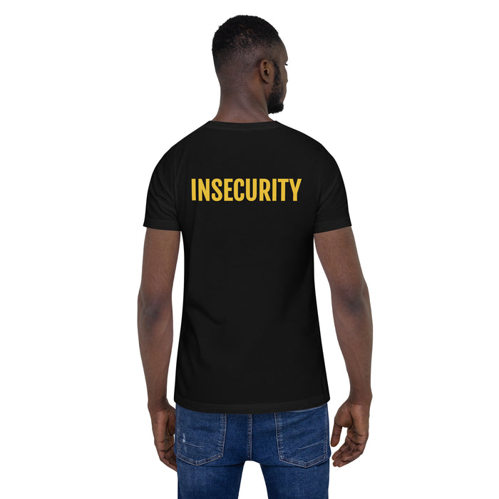 A male model wearing a black t-shirt featuring "INSECURITY" in bold yellow text on the back, styled like a SECURITY shirt.