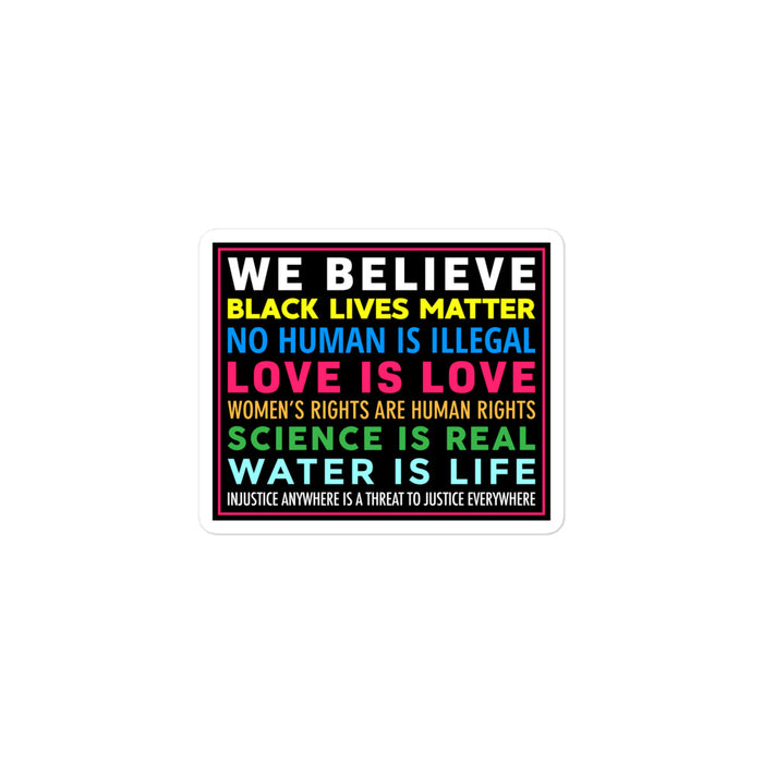 "We Believe" vinyl sticker with multicolored text promoting equality and justice.