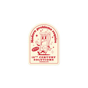 "Modern Problems Require 18th Century Solutions" sticker featuring a retro cartoon guillotine with bold typography.