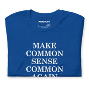 Folded blue t-shirt featuring “Make Common Sense Common Again” in white serif lettering, showcasing print clarity.