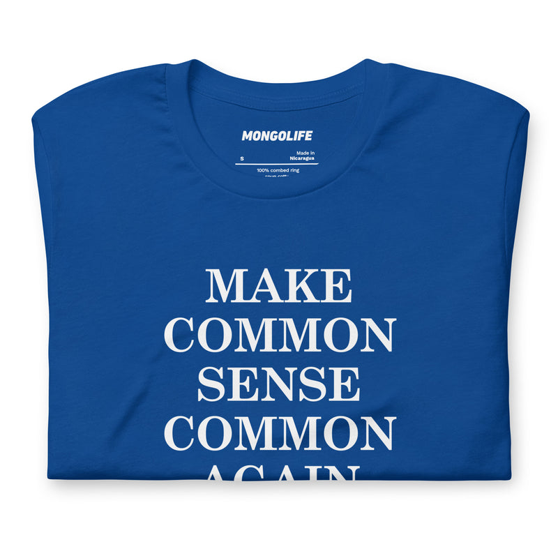 Folded blue t-shirt featuring “Make Common Sense Common Again” in white serif lettering, showcasing print clarity.