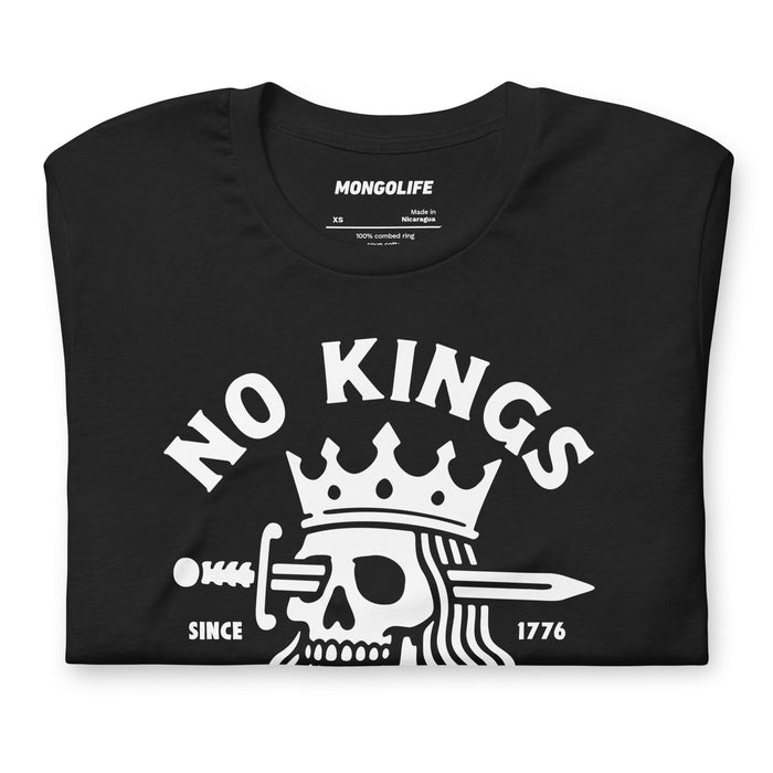 Vintage black t-shirt neatly folded to show the central skull-and-crown artwork and bold protest message.