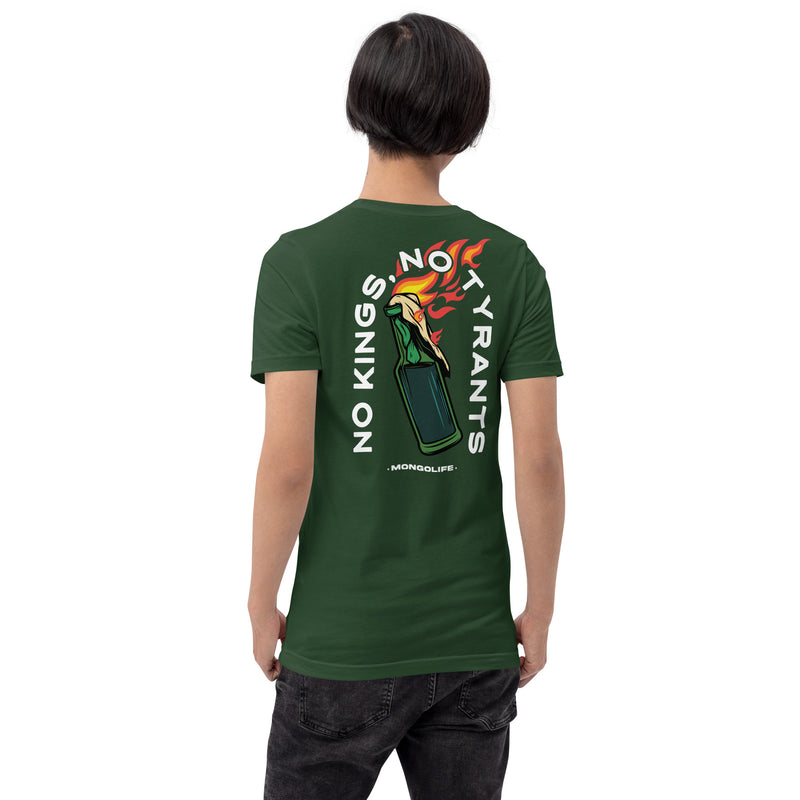 A model wearing the forest green "No Kings, No Tyrants" t-shirt, showing the bold full-back print of a flaming molotov cocktail and anti-authoritarian message.