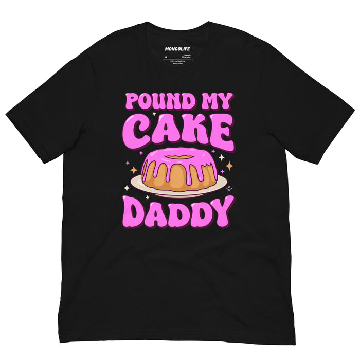 Black t-shirt with bold pink text reading “Pound My Cake Daddy” and a cartoon pound cake with pink icing in the center.