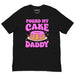 Black t-shirt with bold pink text reading “Pound My Cake Daddy” and a cartoon pound cake with pink icing in the center.