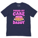 Navy t-shirt featuring large “Pound My Cake Daddy” print in pink lettering with a dripping pound cake illustration.
