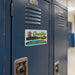 Quality Learing Center 1-800-FRAUD sticker on a blue school locker