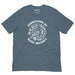 Heather Slate t-shirt with centered white graphic of a bird and plants, and the phrase “Radicalized by Basic Decency.”