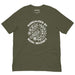 Military Green t-shirt with white floral line art and the phrase “Radicalized by Basic Decency” encircling a bird illustration.
