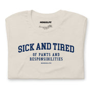 Folded Heather Dust Sick and Tired T-shirt, showcasing the bold text design and soft fabric texture.
