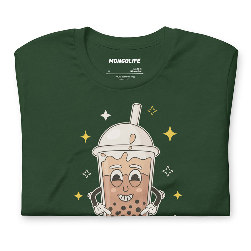Neatly folded forest green t-shirt showcasing the "Suck My Balls" design with a mischievous bubble tea character and tapioca pearls.