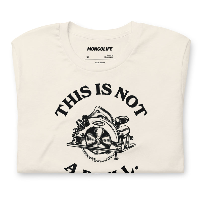 Neatly folded vintage white t-shirt displaying the "This Is Not A Drill" design, perfect for DIY lovers and dad joke enthusiasts.