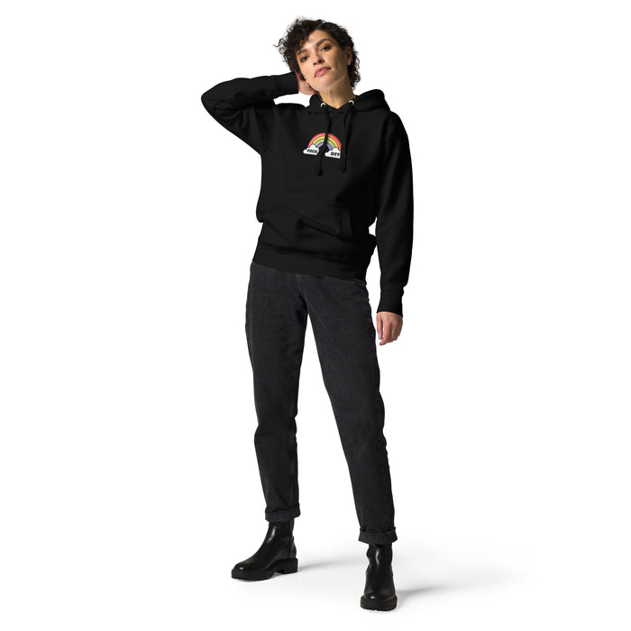 woman wearing a black  hoodie with vibrant rainbow graphic and 'F*ck Off' text, expressing bold attitude.