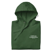 forest green hoodie with "Cultivate Compassion" design, weed (front)