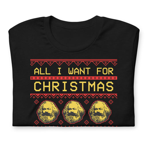 Folded Black t-shirt with "All I Want for Christmas Are the Means of Production" text and Karl Marx pattern, styled like a Christmas sweater.