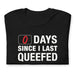 Folded black 0 Days Since I Last Queefed t-shirt with bold text.