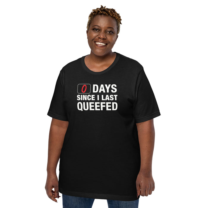 Woman wearing 0 Days Since I Last Queefed t-shirt with bold text.