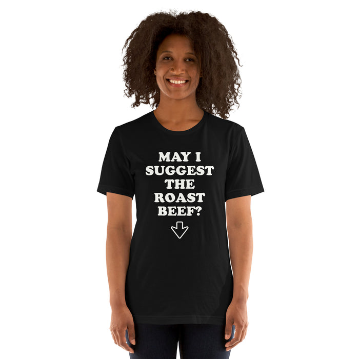 woman wearing a black "May I Suggest The Roast Beef?" t-shirt with a crude joke arrow pointing down.