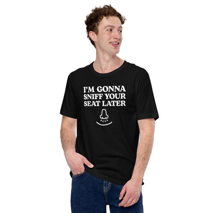 Man wearing a black “I’m Gonna Sniff Your Seat” T-shirt with a small nose icon, part of the embarrassing T-shirts collection.