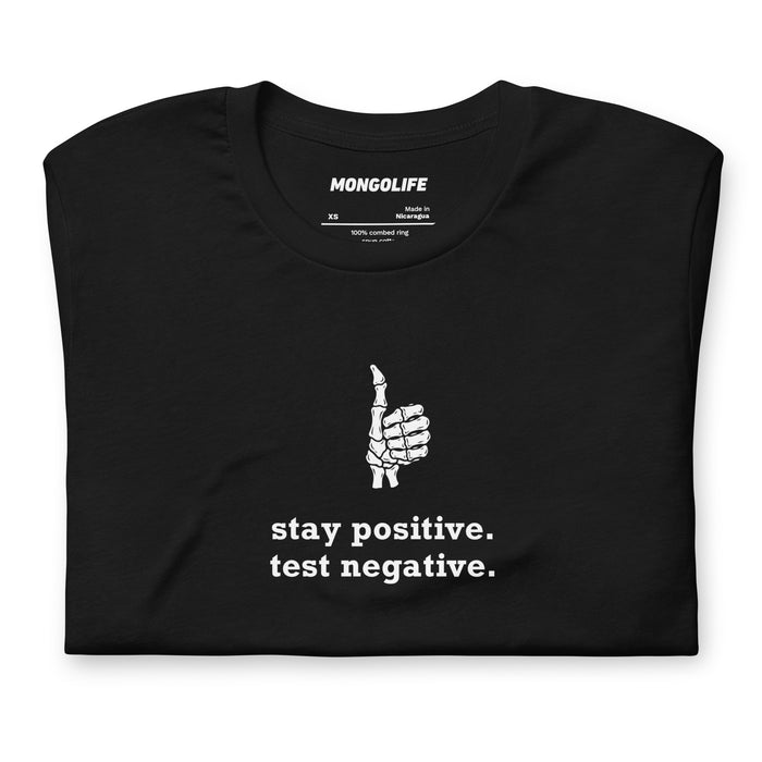 close up of stay positive test negative design skeleton hand thumbs up on black funny tee