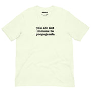 Bright citron yellow t-shirt featuring the "You Are Not Immune to Propaganda" text in contrasting black.