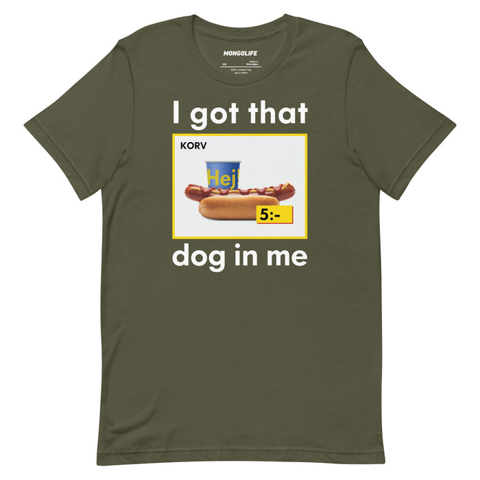 Military green T-shirt featuring the parody hot dog graphic and text "I got that dog in me" in bold, meme-inspired font.