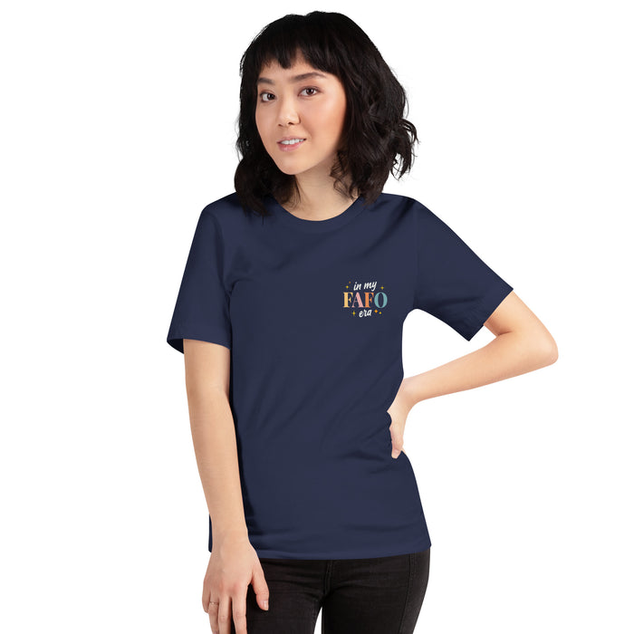 Female model in a navy T-shirt featuring a small left chest design reading "In My FAFO Era" in colorful retro text with stars.