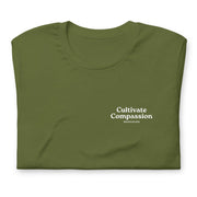 olive t-shirt with "Cultivate Compassion" design, weed (front)
