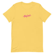 Yellow  casual tee with 'Blazed' logo in pink, decorated with stars and cannabis leaves.